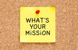 39496834 - what's your mission handwritten on yellow sticky note.